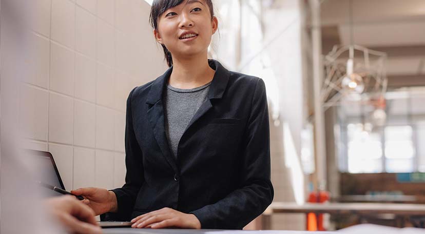 Confident asian business woman giving presentation