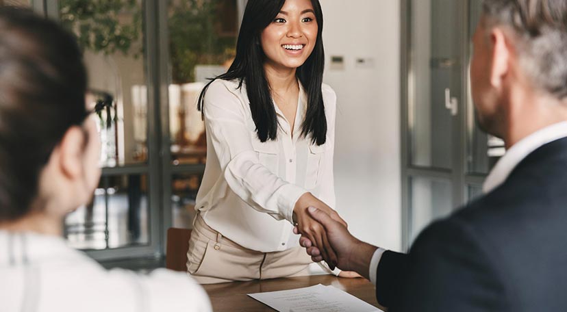 woman-shaking-hands-with-business-partner